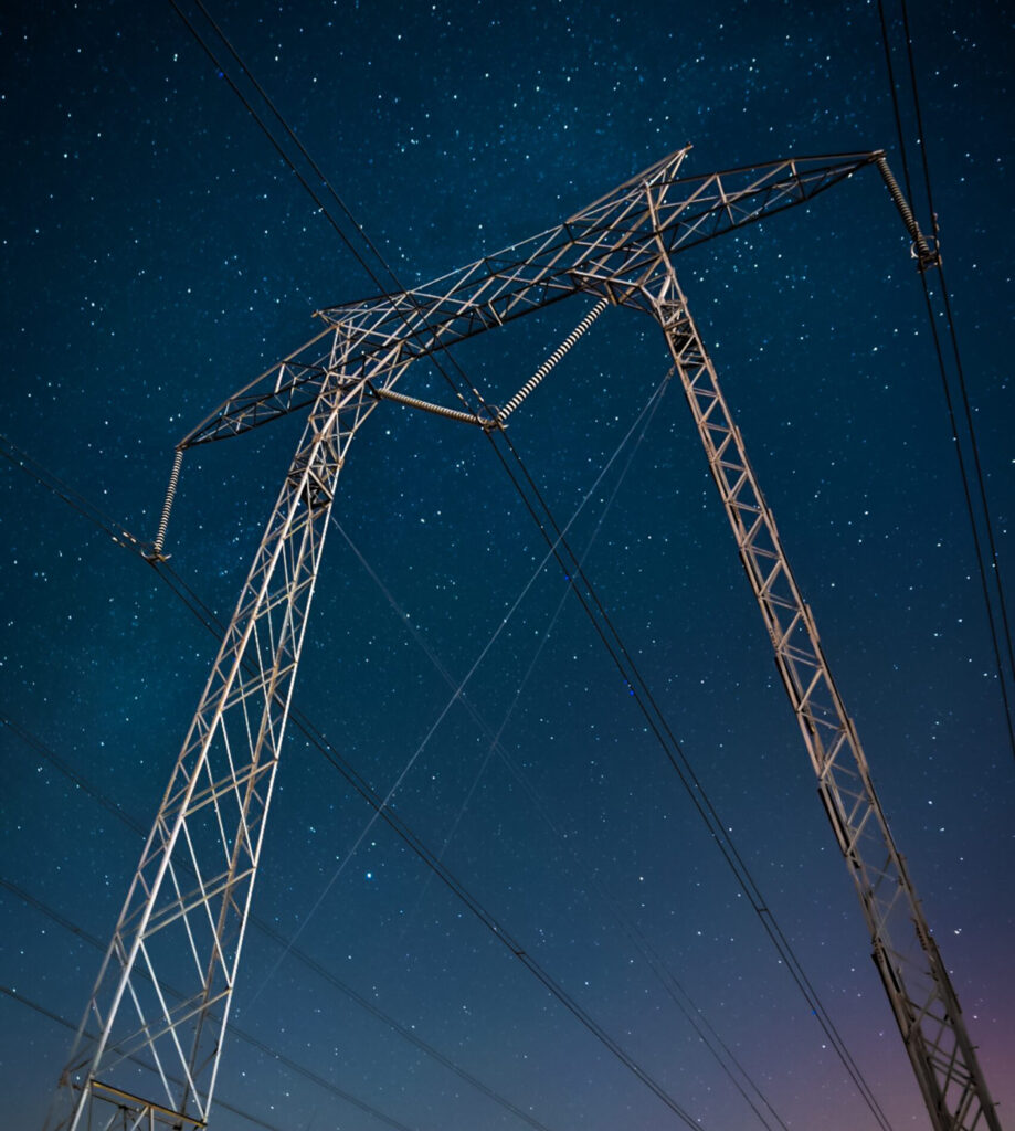 Overhead power line and stars in the sky