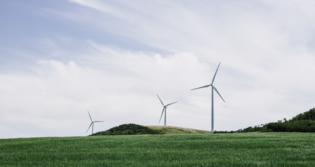 Wind turbines in a landscape with fields.